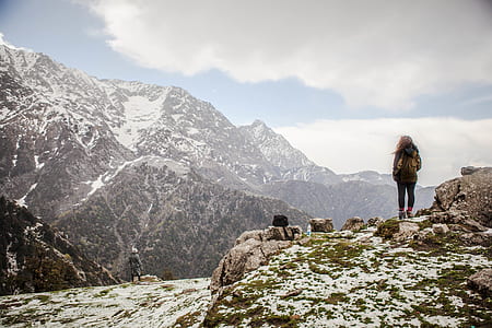 man standing on top of mountain coated with white snow thumbnail