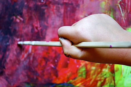 person painting on wall thumbnail