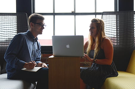 man and woman talking inside room thumbnail