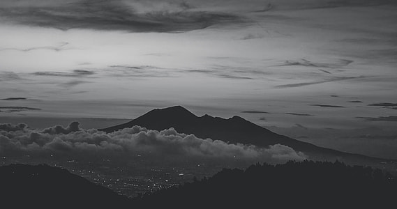 aerial grayscale photo of volcano during cloudy day thumbnail