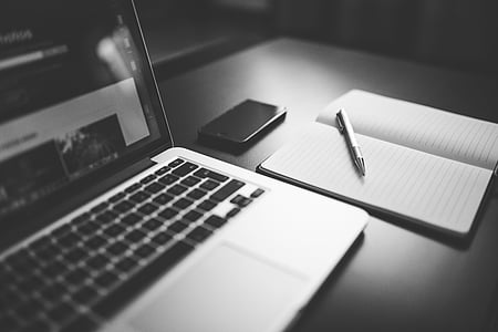 grayscale photo of pen on white notebook thumbnail