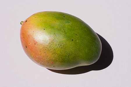 green fruit on white surface thumbnail