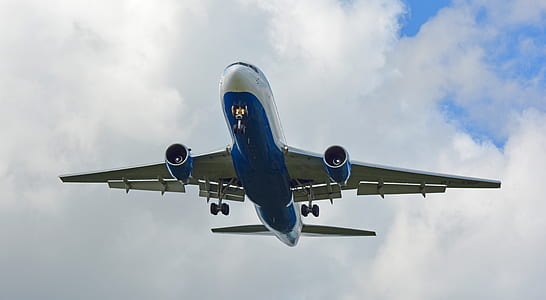 flying blue and white airliner thumbnail
