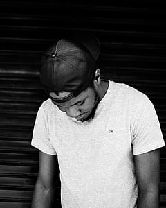 Monochrome Photo of Man Wearing Cap thumbnail