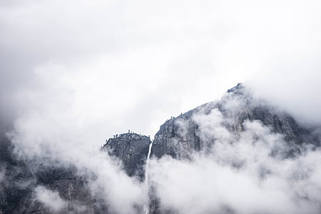 grayscale photography of smoking volcano thumbnail