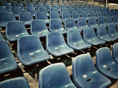 blue audience chair on concrete floor thumbnail