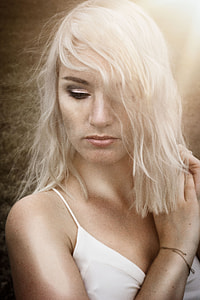 woman holding her hair thumbnail