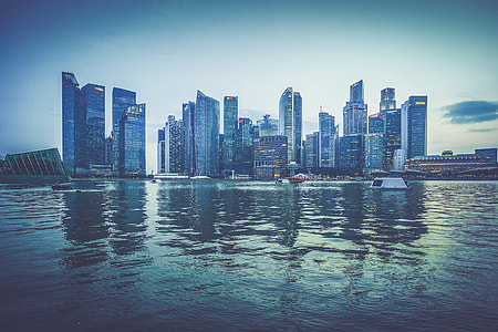 landmark photography of large body of water across high-rise buildings at daytime thumbnail