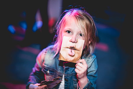 girl holding photo thumbnail