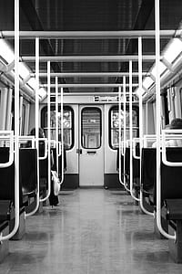 grayscale photo of train interior thumbnail