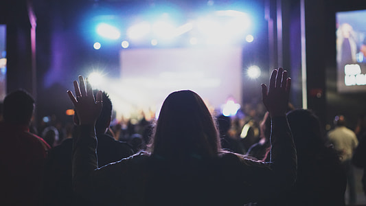 person wearing black shirt watching concert thumbnail