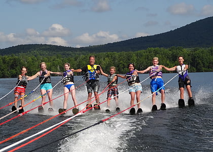people riding water skis thumbnail