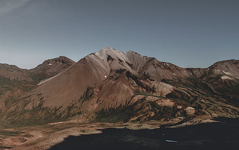 photo of mountain under gray sky thumbnail