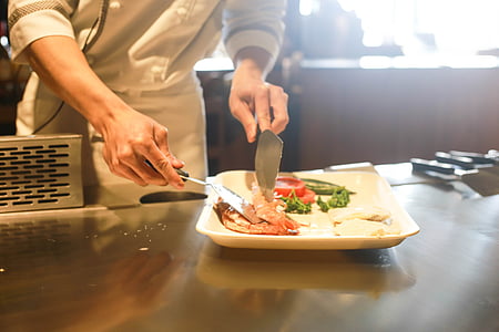 person preparing food on square white plate thumbnail