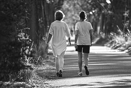 two people walking on road thumbnail