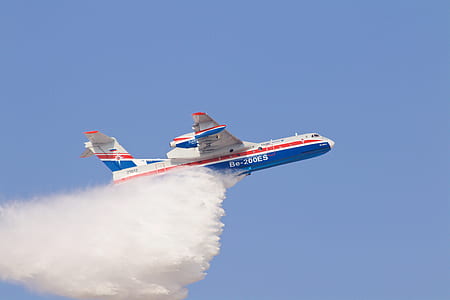 white and blue airplane dropping water thumbnail