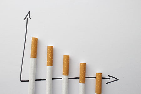 five cigarette sticks on white background thumbnail