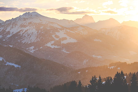 snow capped mountain during golden hour thumbnail