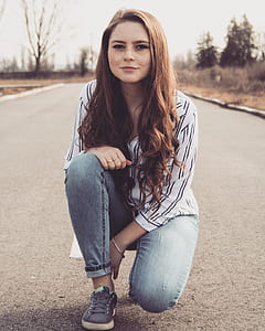 woman sitting on road thumbnail