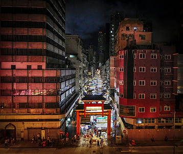 torii gate entrance with crowded people between building thumbnail