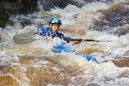 man riding kayak on river thumbnail