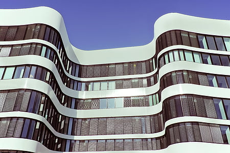 white concrete building under blue sky during daytime thumbnail
