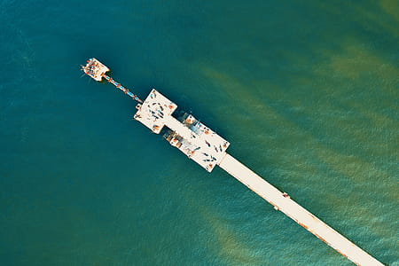 High Angle-photography of White Sea Dock on Green Water thumbnail
