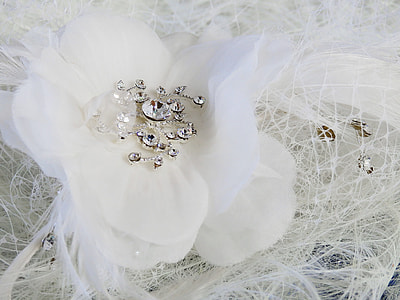 white mesh hair accessory with feather and flower accent thumbnail