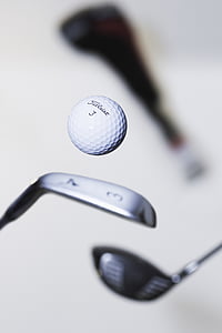 grey golf club and golf ball thumbnail