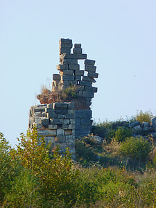 grey stone formation on green grass thumbnail