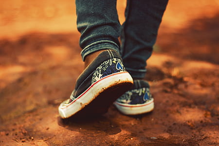 Person Wearing Black Low-top Sneakers and Black Jeans thumbnail