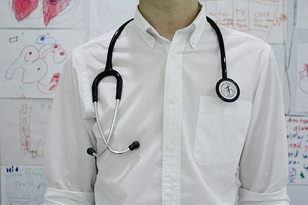man in white dress shirt and stethoscope on neck thumbnail