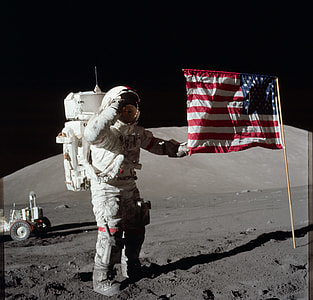 astronaut holding flag of U.S.A. thumbnail