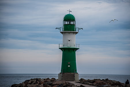 flying seagull near lighthouse thumbnail