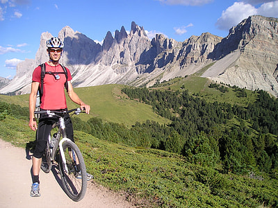 photo of man wearing red shirt riding bicycle thumbnail