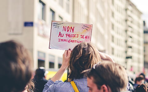 person holding signage thumbnail