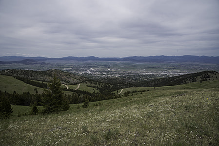 Helena and hill landscape with high mountains on the mountainside under grey skies thumbnail