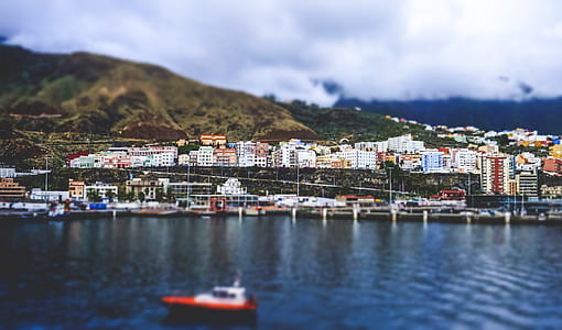 landscape photography of buildings near sea thumbnail