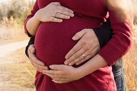 woman holding her tummy thumbnail