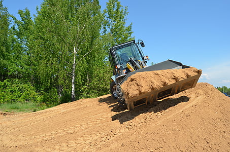 black front-end loader digging soil thumbnail