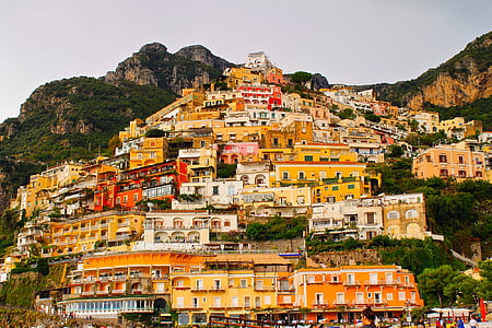 assorted-color houses on top of mountain at daytime thumbnail