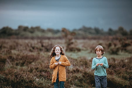 boy and girl on green field thumbnail