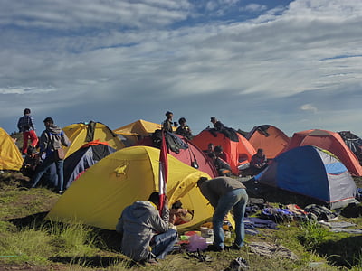photo of people standing beside tents thumbnail