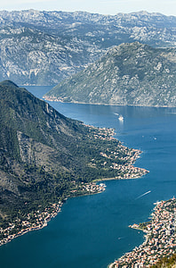 aerial view of mountain near body of water thumbnail