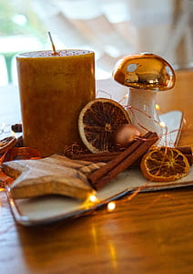 brown candle on brown wooden table thumbnail