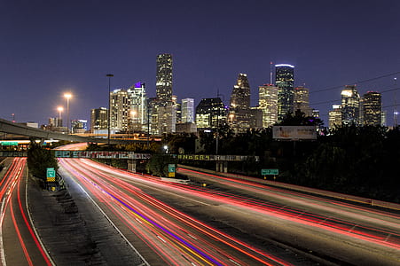 timelapse photo of vehicle running on street during night time thumbnail