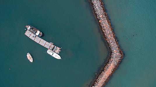 aerial photo of yacht and ship on sea thumbnail