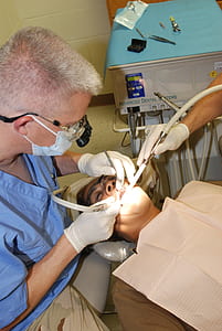 dentist doing operation on woman thumbnail