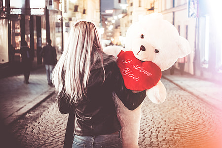 Young Woman Holding Her Big Valentine’s Day Gift Teddy Bear thumbnail