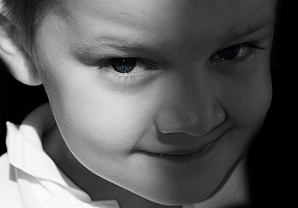 grayscale photo of toddler making face thumbnail